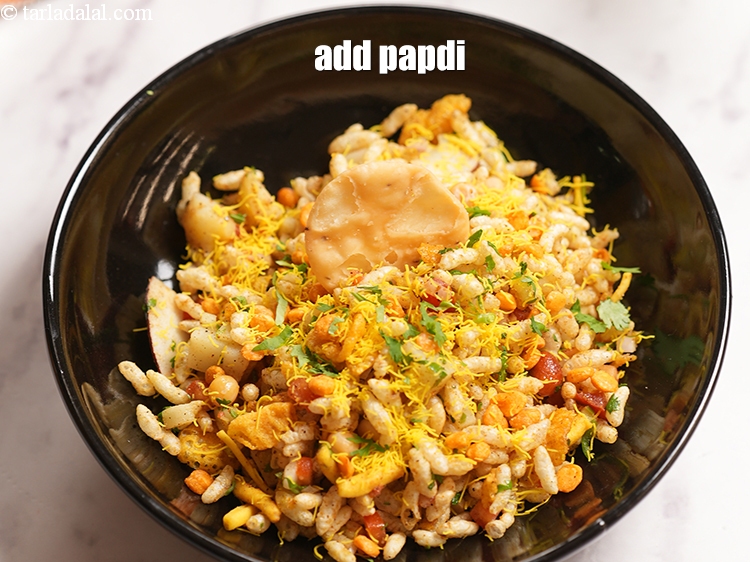 Step 25 – Add&nbsp;<a href="https://www.tarladalal.com/glossary-papdi-chaat-chaat-ki-puri-1999i">papdi</a>.