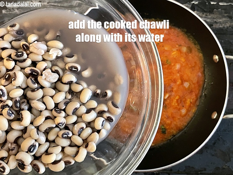 Step 31 – <p>Add the cooked chawli, along with the water.</p>