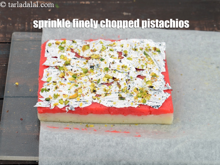 Step 24 – Sprinkle &frac12; tsp finely <a href="https://www.tarladalal.com/glossary-chopped-pistachios-893i">chopped pistachios</a>.