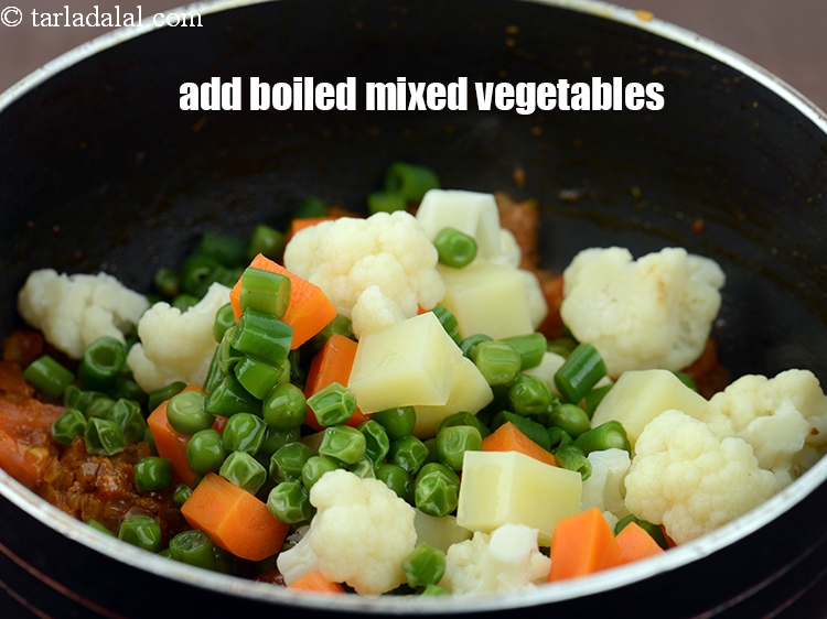 Step 29 – Add 1 1/2 cups&nbsp;<a href="https://www.tarladalal.com/glossary-boiled--mixed-vegetables-1018i">boiled mixed vegetables</a>&nbsp;(carrots , peas , cauliflower , french beans , …