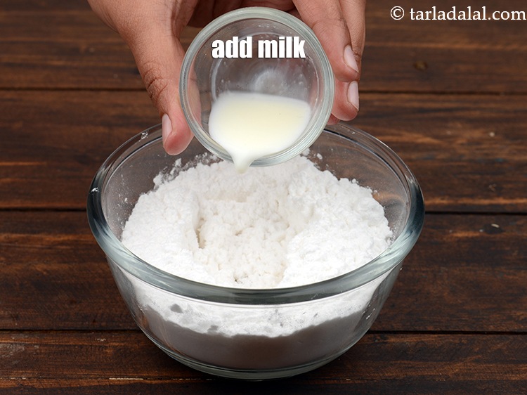 Step 25 – Add 2 tbsp&nbsp;<a href="https://www.tarladalal.com/glossary-milk-doodh-full-cream-milk-514i">milk</a>.