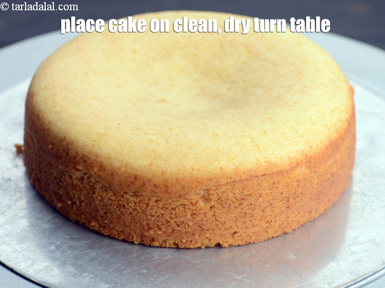 Step 26 – Place the cake on a clean, dry turn table.