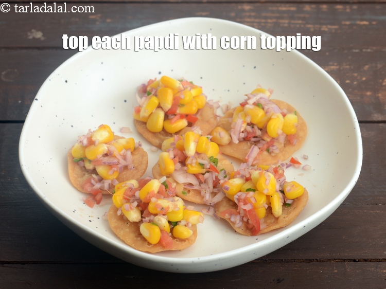 Step 30 – Top each papdi with 2 tsp of the corn topping.&nbsp;