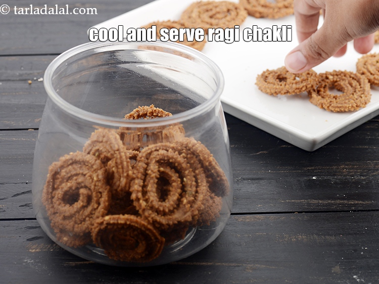 Step 24 – Cool <strong>ragi chakli recipe | nachni chakli | ragi murukku </strong>completely&nbsp;and serve or store in …