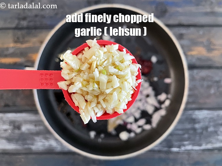 Step 24 – Add&nbsp;<meta charset="UTF-8" />2 tbsp&nbsp;finely&nbsp;<a href="glossary-chopped-garlic-790i">chopped garlic (lehsun)</a>.