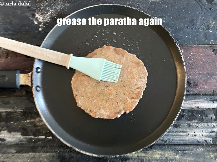 Step 24 – Grease the paratha again.