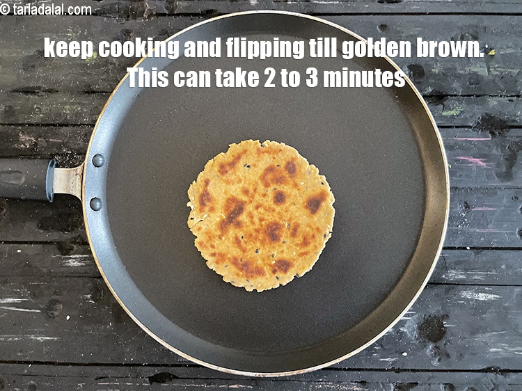 Step 24 – <meta charset="UTF-8" />You will have to keep cooking the khakhra and flipping it till done.&nbsp;