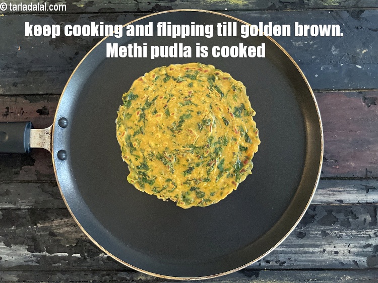 Step 23 – Keep cooking and flipping pudla till golden brown.&nbsp;Methi pudla is cooked.