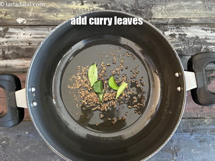 Step 26 – Add&nbsp;<meta charset="UTF-8" />5&nbsp;<a href="glossary-curry-leaves-kadi-patta-kadipatta-388i">curry leaves (kadi patta)</a>.