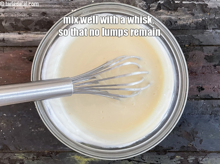 Step 51 – Mix curd besan mixture&nbsp;well with a whisk so that no lumps remain. Ensure that no …