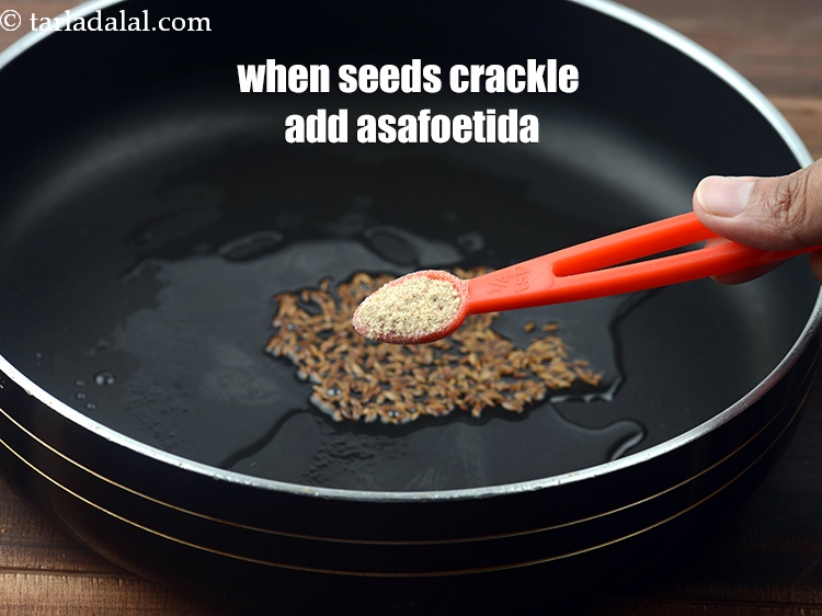 Step 24 – When the seeds crackle add 1/4 tsp&nbsp;<a href="https://www.tarladalal.com/glossary-asafoetida-hing-113i">asafoetida (hing)</a>.