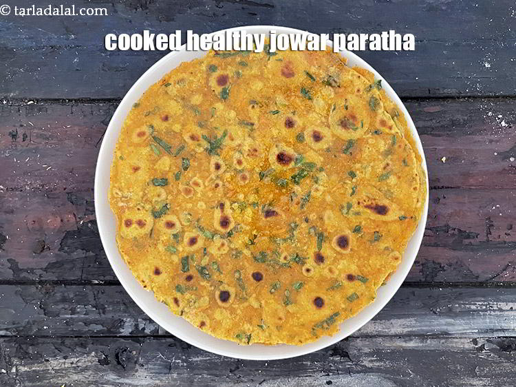 Step 24 – Place the cooked <strong>jowar vegetable paratha | healthy jowar thepla | tiffin box paratha |</strong> …