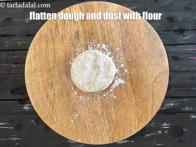 Step 26 – <meta charset="UTF-8" />Flatten the dough on a rolling board and dust with flour.&nbsp;&nbsp;&nbsp;