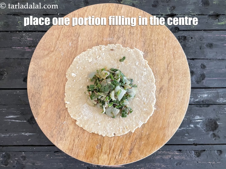 Step 26 – Place one portion of the filling in the centre of the dough circle.