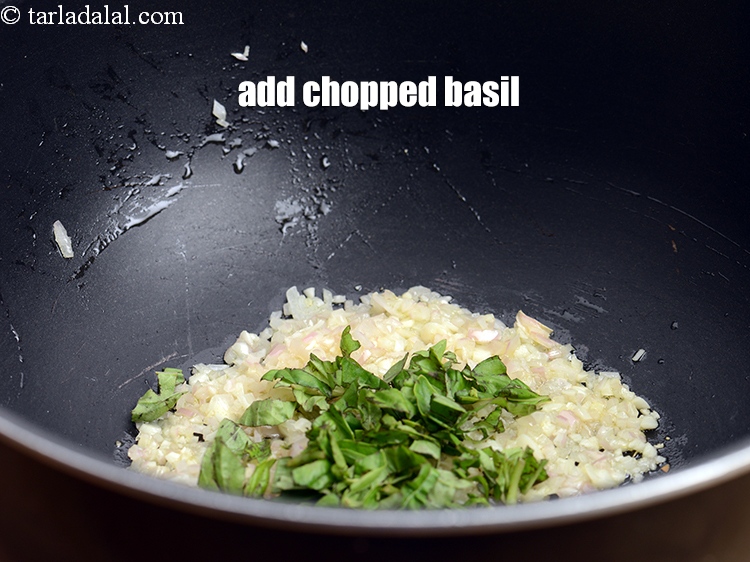 Step 26 – Add 1 tbsp <a href="https://www.tarladalal.com/glossary-chopped-basil-804i">chopped basil</a>.