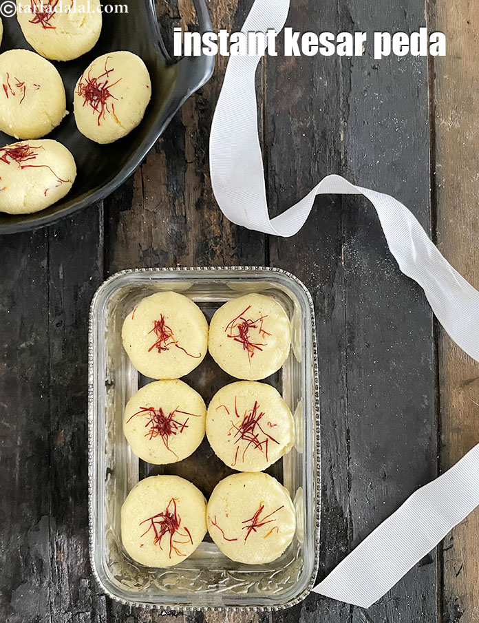 Step 24 – <meta charset="UTF-8" /> Serve or store the&nbsp;kesar peda&nbsp;in an air-tight container and refrigerate.