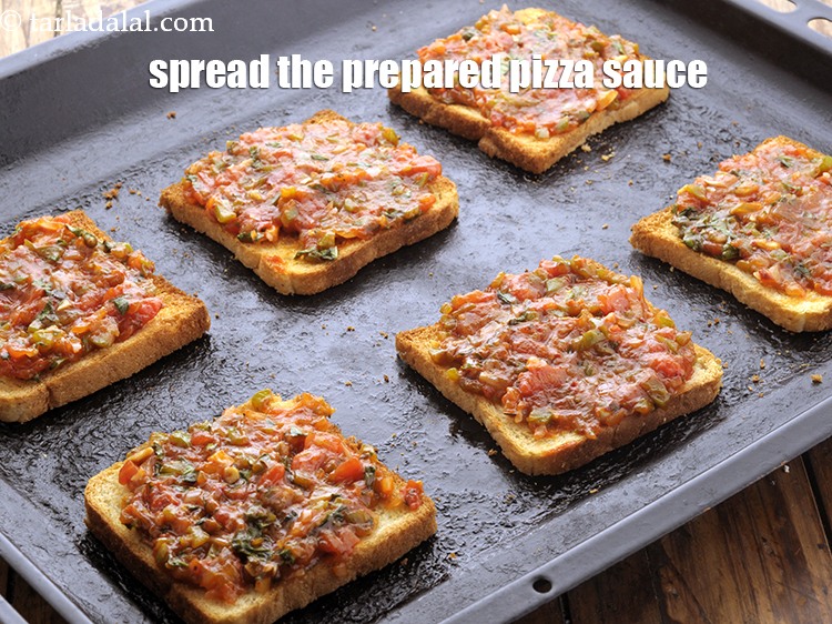 Step 23 – Spread a portion of the prepared pizza sauce evenly over each bread slice.