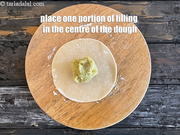 Step 24 – Place one portion of the filling mixture in the centre of the circle.