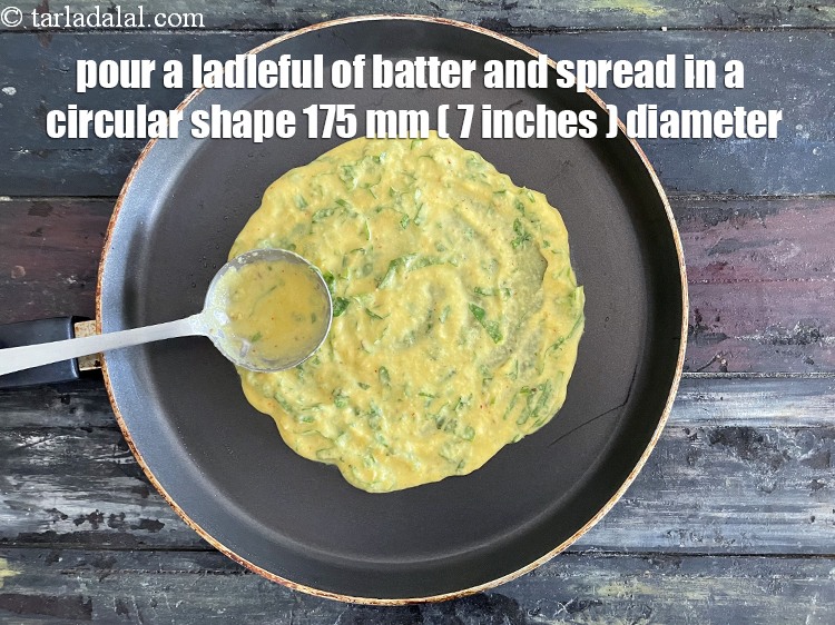 Step 26 – Pour a ladeful of batter and spread in a circular shape of 175 mm ( …