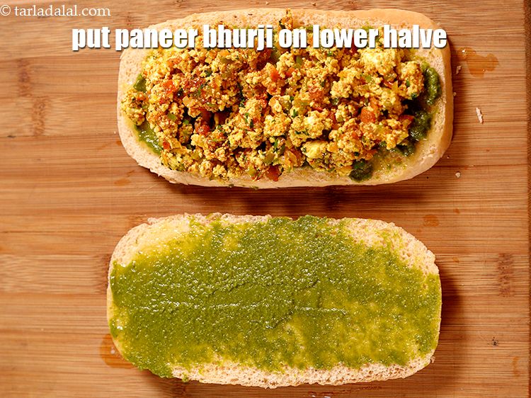 Step 28 – Put a portion of the paneer bhurji on the lower halve and spread it evenly.&nbsp;
