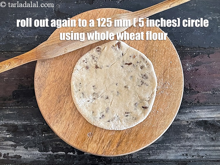 Step 31 – Lightly press the sides using your fingers and roll out again into a circle of …