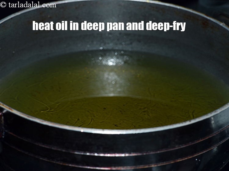 Step 24 – Heat the oil in a deep non-stick kadhai and deep-fry 2 to 3 bread rolls, …