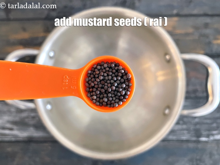Step 24 – Add&nbsp;<meta charset="UTF-8" />2 tsp&nbsp;<a href="glossary-mustard-seeds-sarson-rai-sarson-ke-beej-525i">mustard seeds ( rai / sarson)</a>.