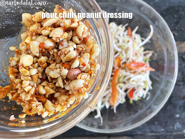 Step 18 – Pour the chilli peanut dressing over it.