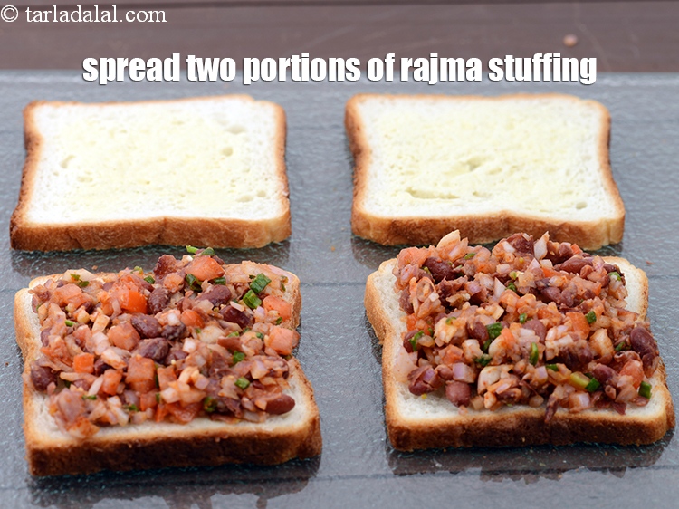 Step 24 – Spread two portions of the rajma stuffing evenly on 2 buttered slices.