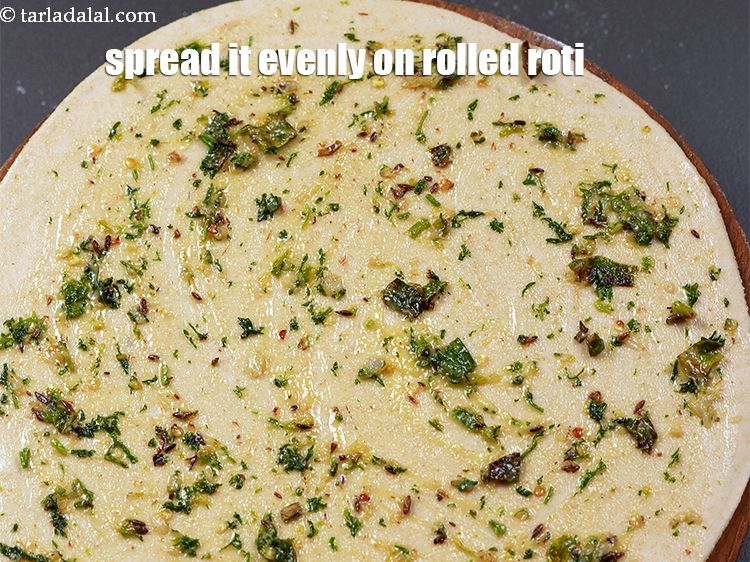 Step 24 – Spread it evenly on the rolled roti.