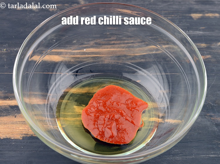 Step 25 – Add 2 tbsp&nbsp;<a href="https://www.tarladalal.com/glossary-red-chilli-sauce-lal-chilli-sauce-810i">red chilli sauce</a>.