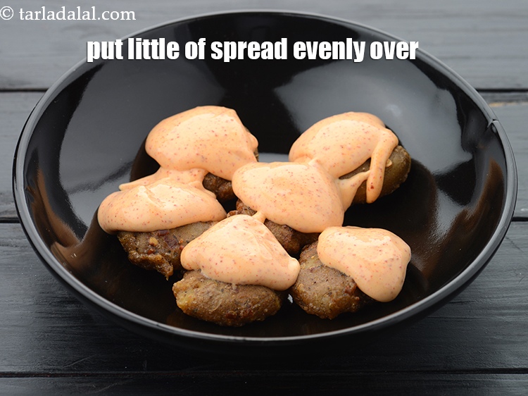 Step 24 – Put little of the prepared spread evenly over them.&nbsp;
