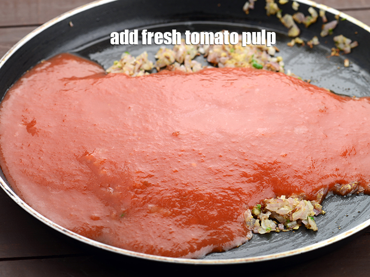 Step 24 – Add 1 cup <a href="https://tarladalal.com/fresh-tomato-pulp-38652r">fresh tomato pulp</a>.