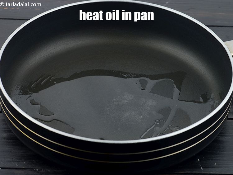 Step 25 – Heat <a href="https://www.tarladalal.com/glossary-oil-671i">oil</a>&nbsp;in a non-stick pan.