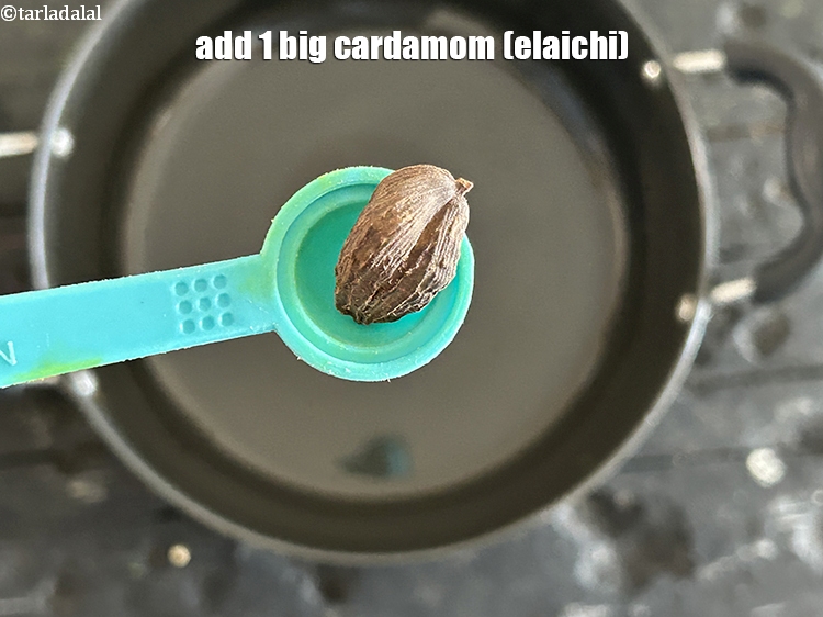 Step 25 – Add&nbsp;<meta charset="UTF-8" />1&nbsp;big&nbsp;<a href="glossary-cardamom-elaichi-262i">cardamom (elaichi)</a>.
