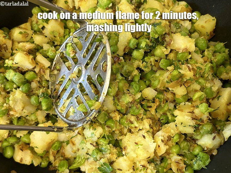 Step 25 – Cook on a medium flame for 2 minutes, mashing lightly.