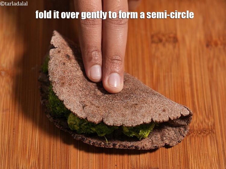 Step 26 – Fold it over gently to form a semi-circle.
