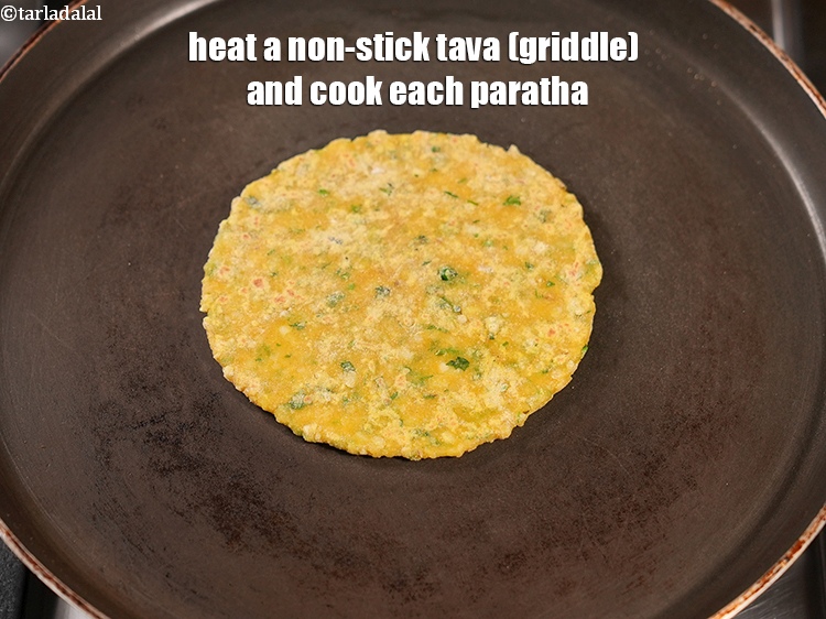 Step 25 – Heat a non-stick tava (griddle) and cook each paratha.<br /> &nbsp;