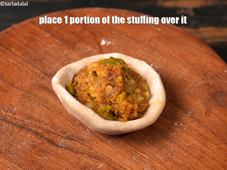 Step 24 – Place 1 portion of the stuffing over it.