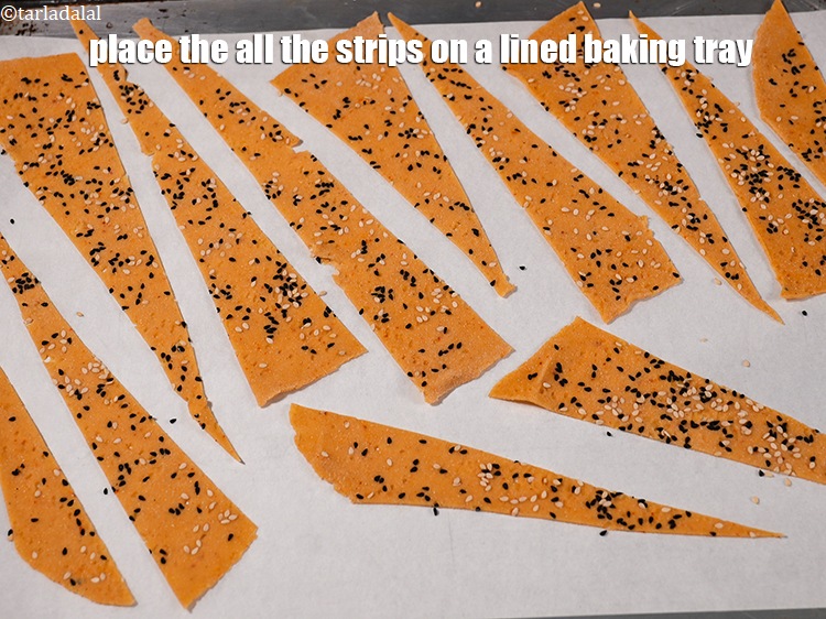 Step 26 – <p>Place the all the strips on a lined baking tray.</p>