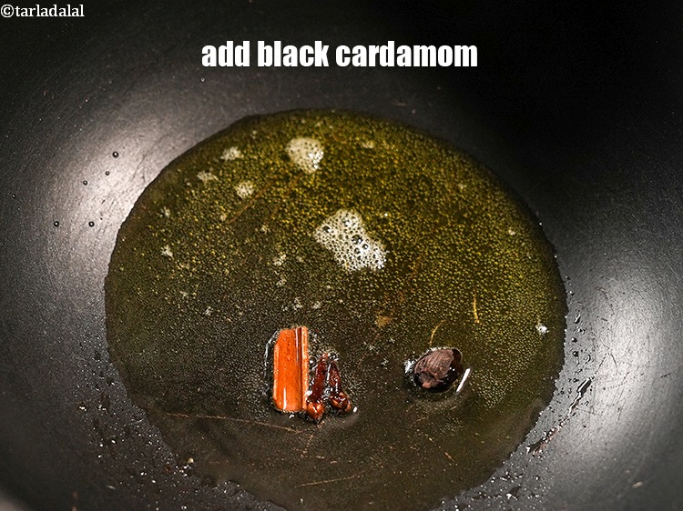 Step 26 – Add 1 <a href="https://www.tarladalal.com/glossary-black-cardamom-badi-elaichi-moti-elaichi-263i">black cardamom (badi elaichi)</a>.&nbsp;