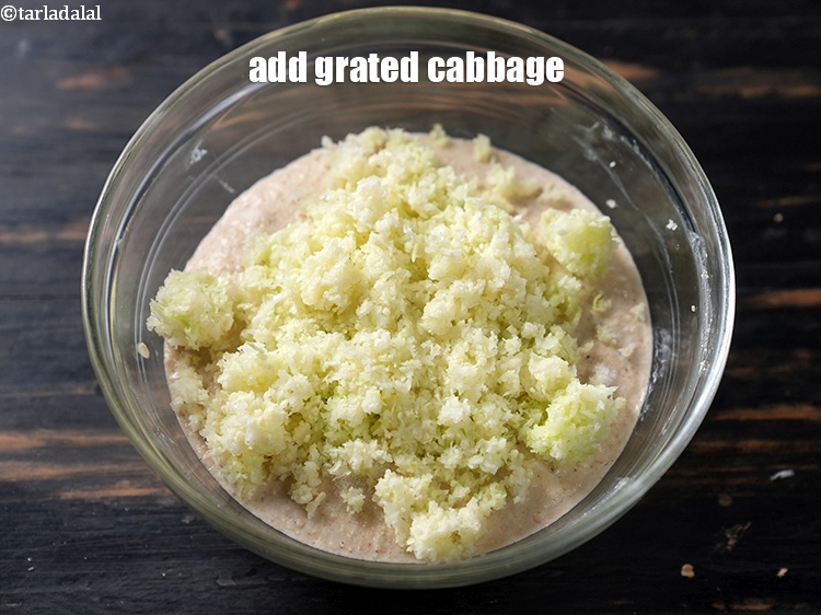 Step 25 – Add 1 cup <a href="https://www.tarladalal.com/glossary-grated-cabbage-860i">grated cabbage</a>.