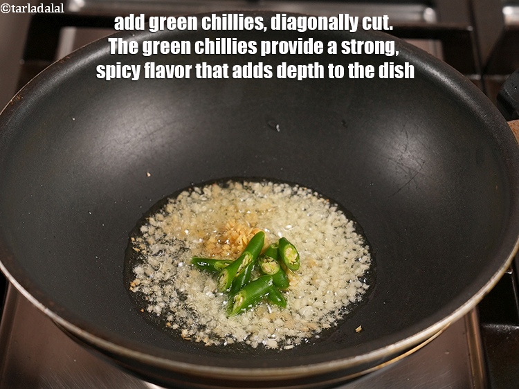 Step 25 – Add 2 <a href="https://www.tarladalal.com/glossary-green-chillies-hari-mirch-331i">green chillies</a>, diagonally cut. The green chillies provide a strong, spicy flavor …