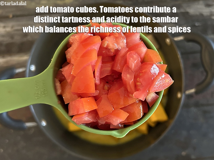 Step 26 – <html><head></head><body><p>Add&nbsp;1/2 cup&nbsp;<a href="glossary-tomato-cubes-728i">tomato cubes</a>.&nbsp;&nbsp;Tomatoes contribute a distinct tartness and acidity to the sambar,&nbsp;which balances the …