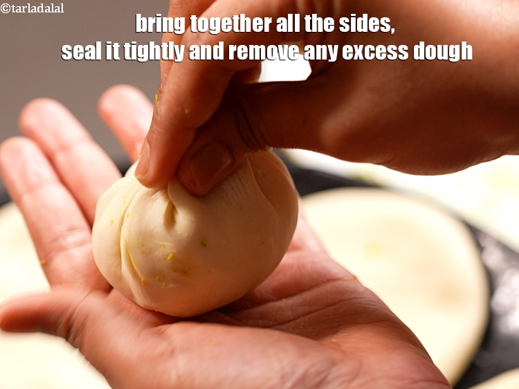 Step 25 – Bring together all the sides, seal it tightly and remove any excess dough.