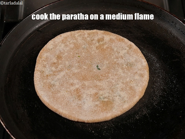 Step 37 – Cook the paratha on&nbsp;a medium flame.