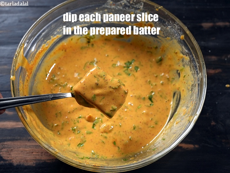 Step 25 – Dip each masala paneer slice in the prepared batter.