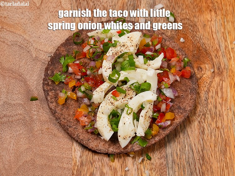 Step 26 – Garnish the taco with little spring onion whites and greens.