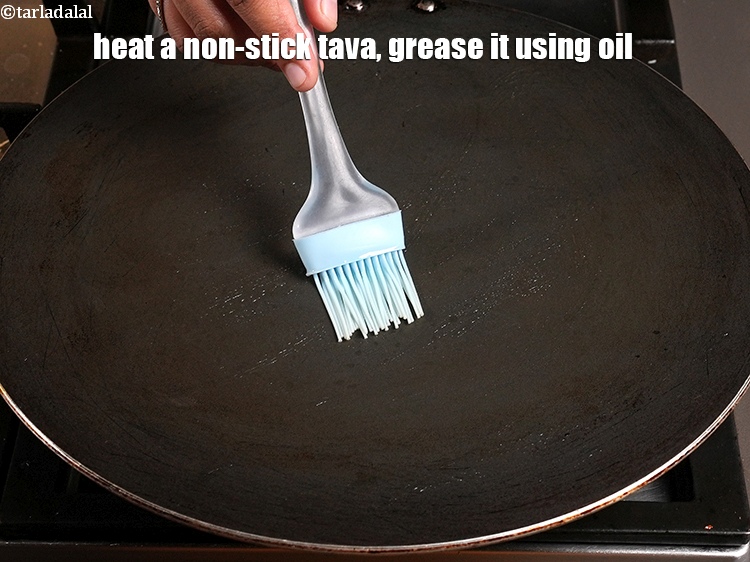Step 25 – Heat a non-stick tava (griddle), grease it using 1/4 tsp oil.