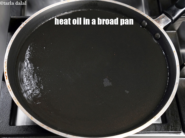 Step 25 – Heat &frac12; tbsp oil in a broad pan.